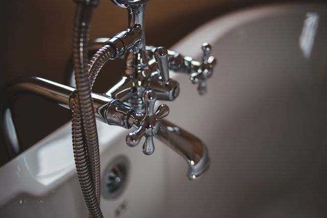 Bathtub faucet and plumbing fixture close up